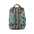 Backpack with whale pattern on a light blue background