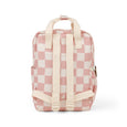 Pink and white checkered backpack on a white background