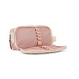 Pink toiletry bag with ruffled details on a white background