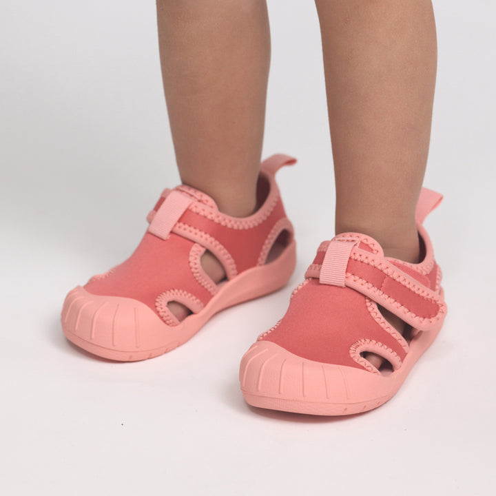coral children's crywolf sandals on a white background