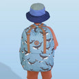 Person wearing a blue backpack with whale pattern and a blue hat on a light blue background