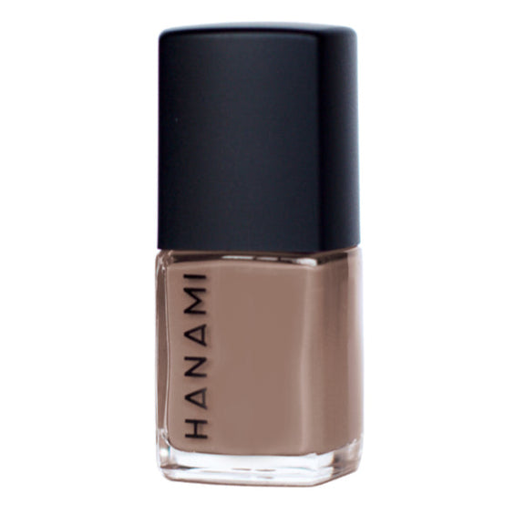 Nail polish bottle with black cap and visible brand name on a white background