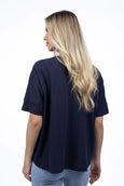 Woman wearing a navy blue t-shirt on a white background