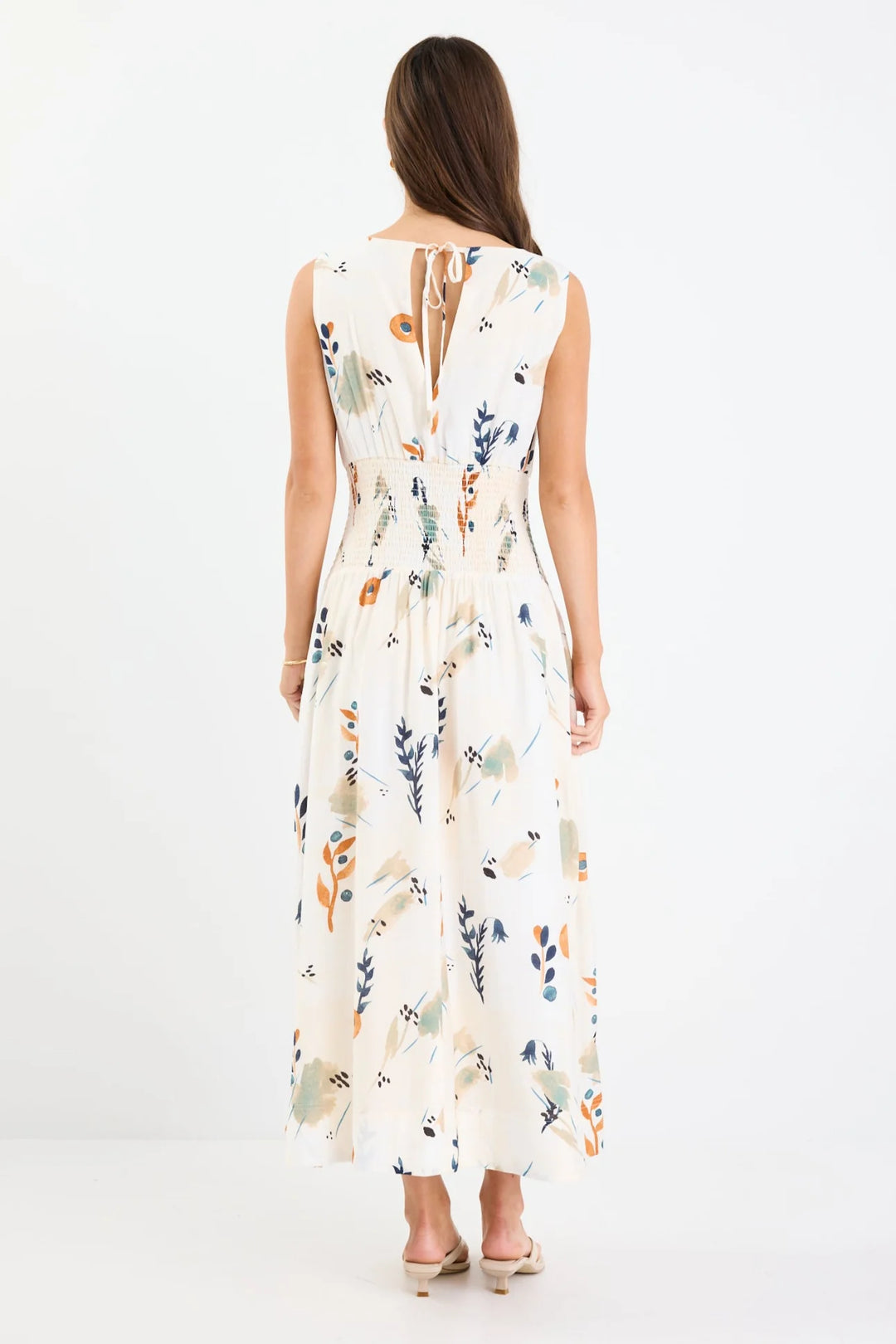 Woman wearing a floral dress on a white background