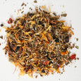 Mixture of dried herbs and spices on a white background