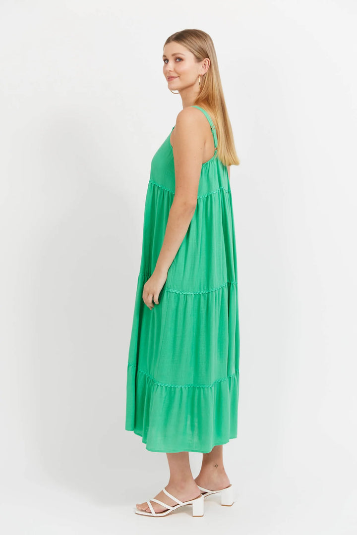 Woman wearing a green dress on a white background