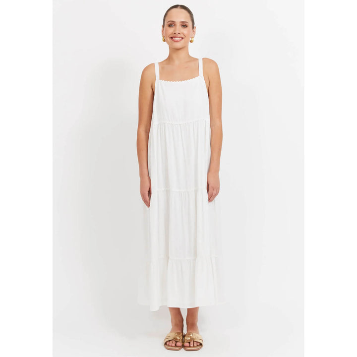 Woman wearing a white haven dress on a white background