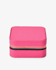 Pink jewelry box with a gold zipper on a white background