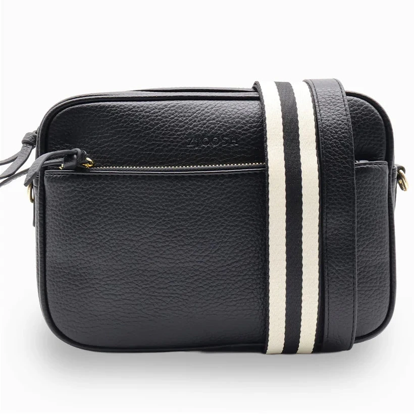 Black leather crossbody bag with a white stripe on a white background