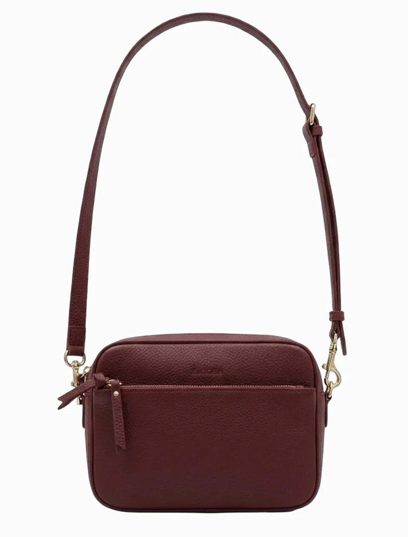 Brown leather crossbody bag on a white background