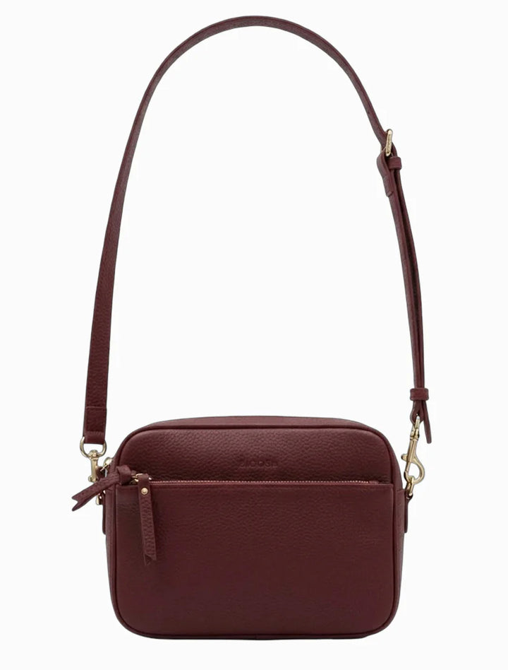 Brown leather crossbody bag on a white background