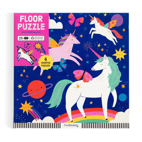 Floor puzzle packaging with unicorns and space-themed design on a blue background