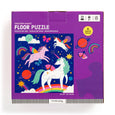 Unicorn-themed floor puzzle packaging with colorful illustrations on a purple background