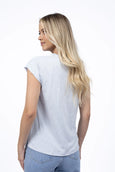 Woman wearing a plain white t-shirt and blue jeans on a white background