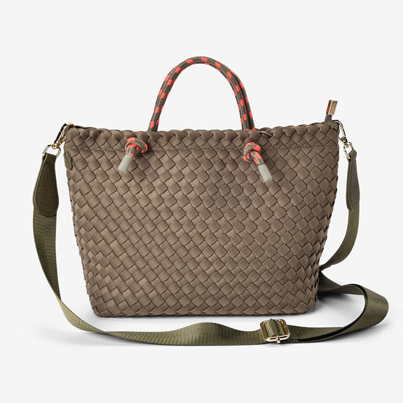 Woven handbag with a strap on a white background