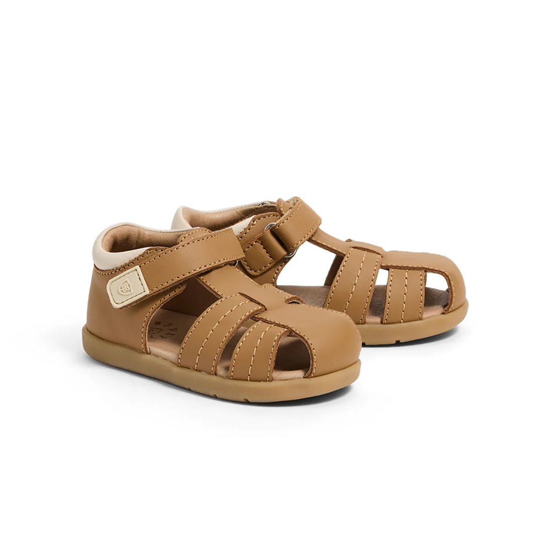 Pair of brown children's sandals on a white background