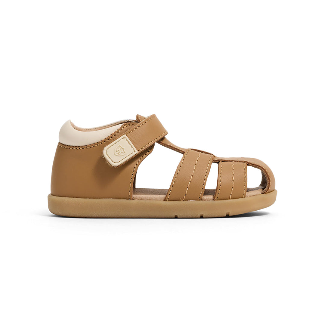 Brown sandal with a white sole on a white background
