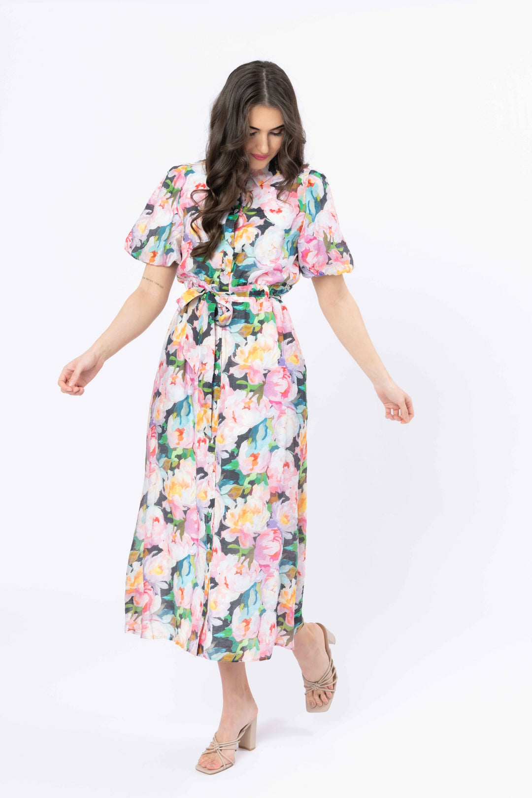 Woman wearing a floral dress on a white background