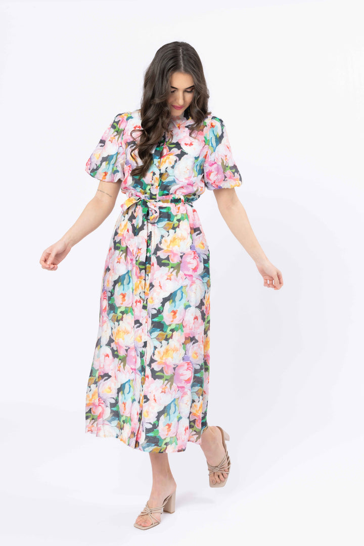 Woman wearing a floral dress on a white background