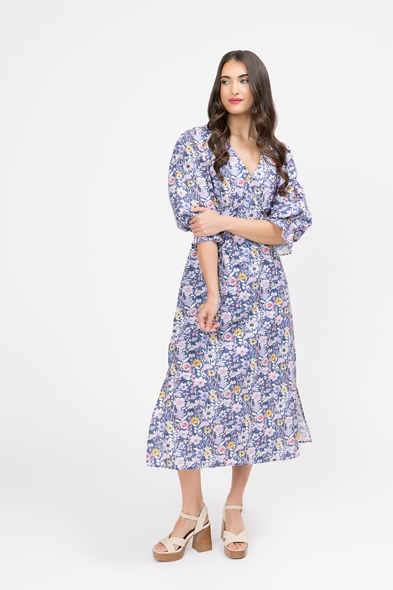 Woman wearing a floral dress on a white background