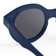 Blue sunglasses with a gray lens on a white background