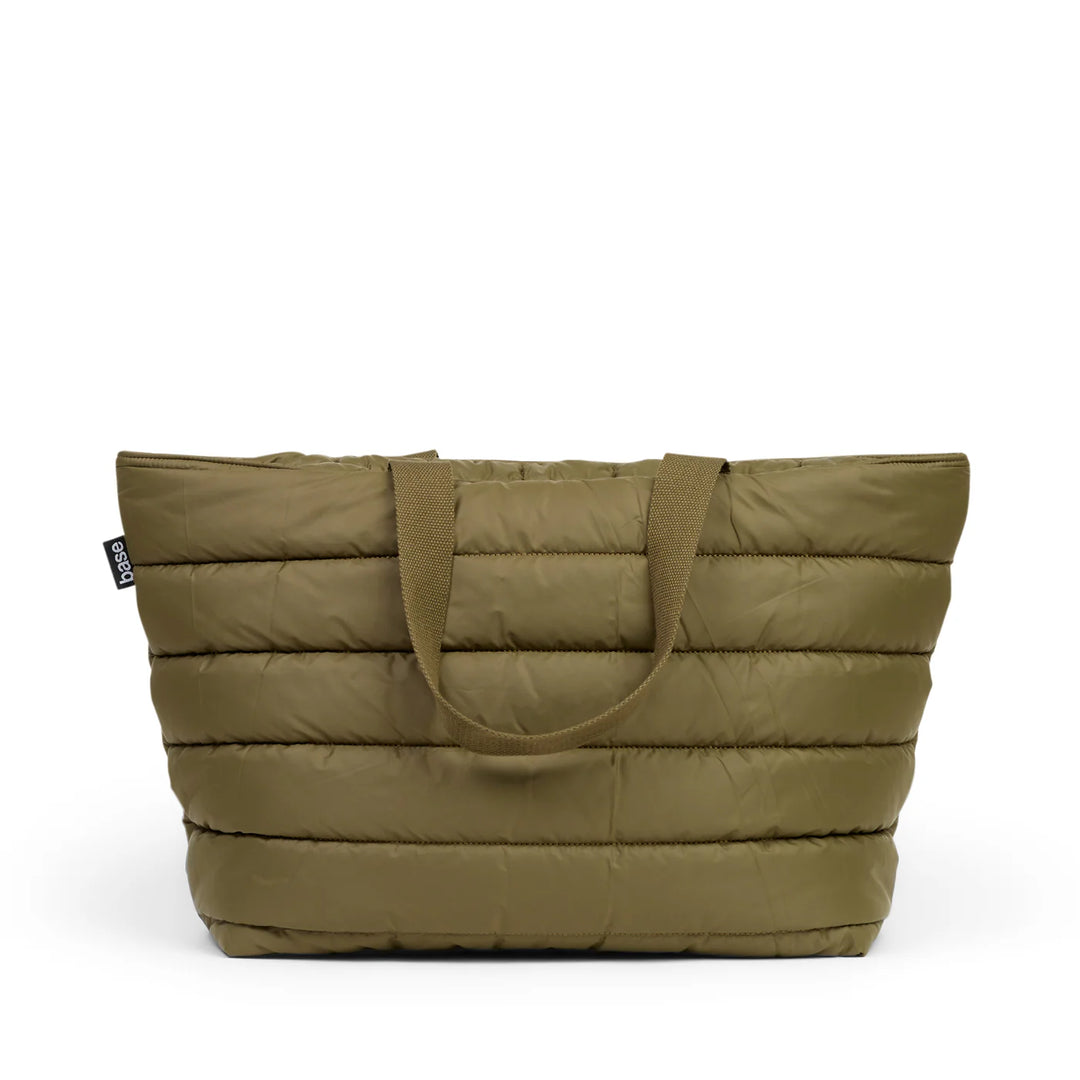 Green quilted tote bag on a white background