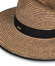 Beige straw hat with black rim on a white background