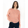 Woman wearing a pink sweater on a white background