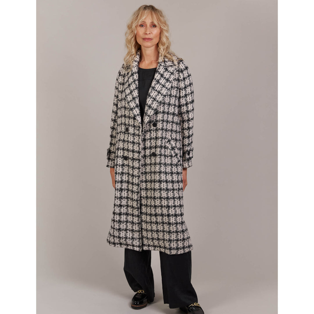 Discover refined winter styling with the Aman Coat, your ultimate companion for a polished, sophisticated look. Available from www.thecollectivenz.com 