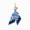 Keychain with a blue and white striped scarf on a white background