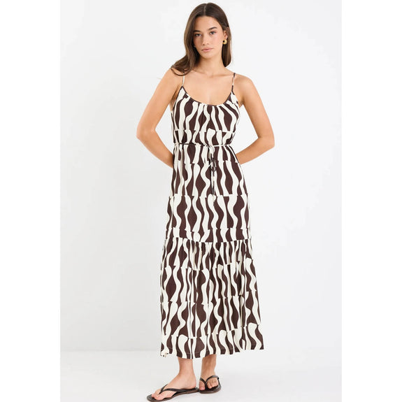 Woman wearing a zebra print dress on a white background
