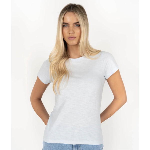 Woman wearing a plain white t-shirt against a white background
