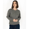 Woman wearing a gray sweater on a white background