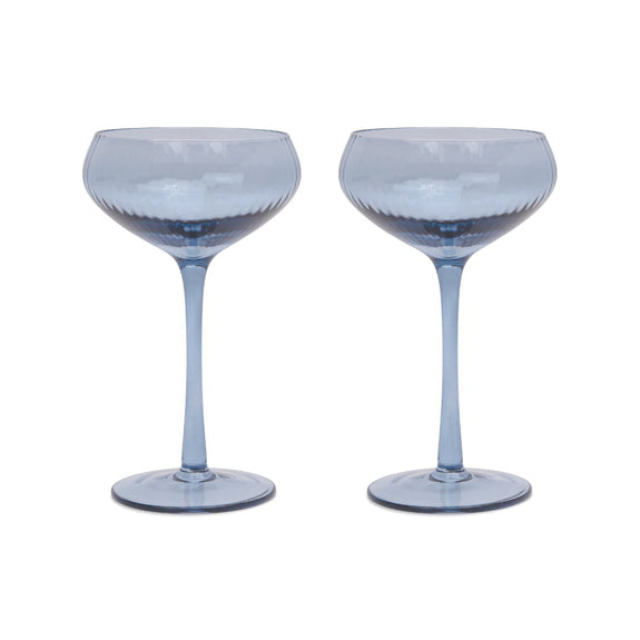 Two blue cocktail glasses on a white background