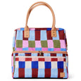 Multicolored checkered cooler bag with brown handles and trim on a white background