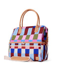Colorful checkered cooler bag with brown handles and trim on a white background