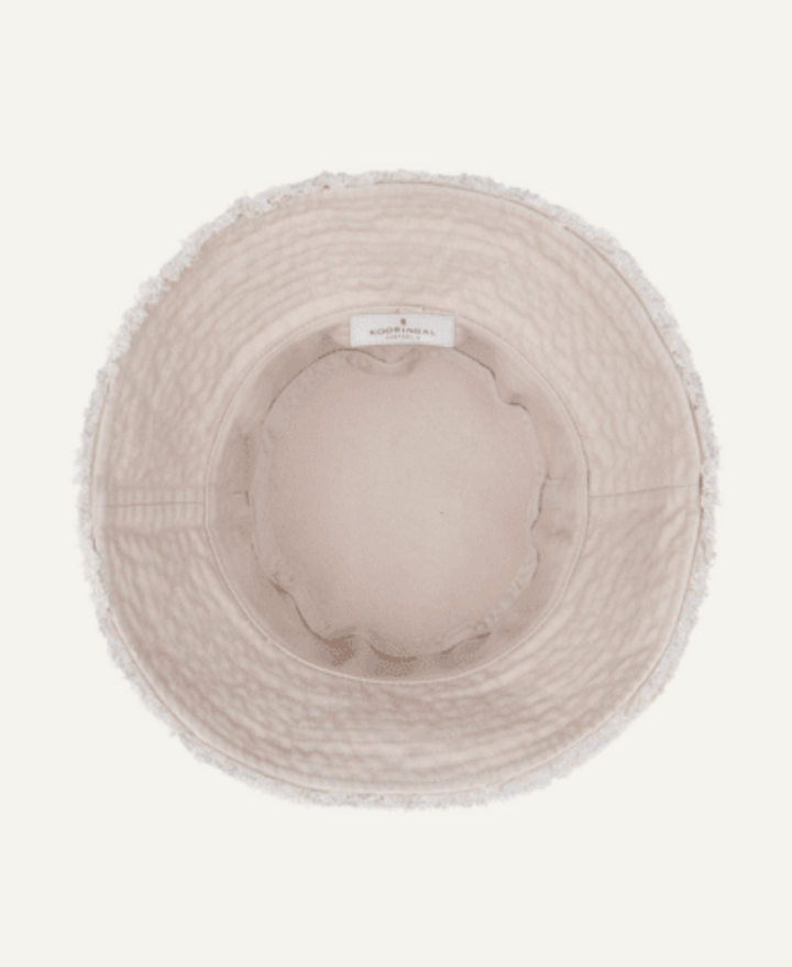 Beige bucket hat with a visible brand label on a white background