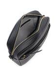 Black leather bag with gold zipper on a white background