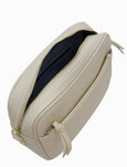 Beige cosmetic bag with a zipper on a white background