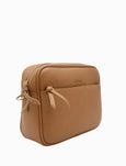 Tan leather crossbody bag on a white background