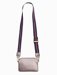 Small gray crossbody bag with a striped strap on a white background