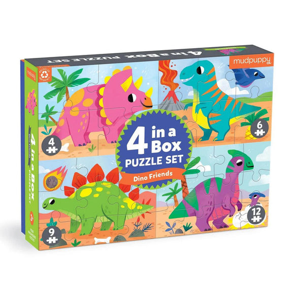 Box of Mudpuppy 4-in-a-Box puzzle set with colorful dinosaur illustrations on a white background