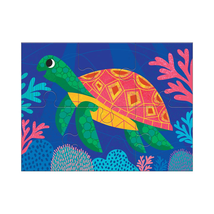 Colorful turtle puzzle with a blue background featuring sea plants on a white background