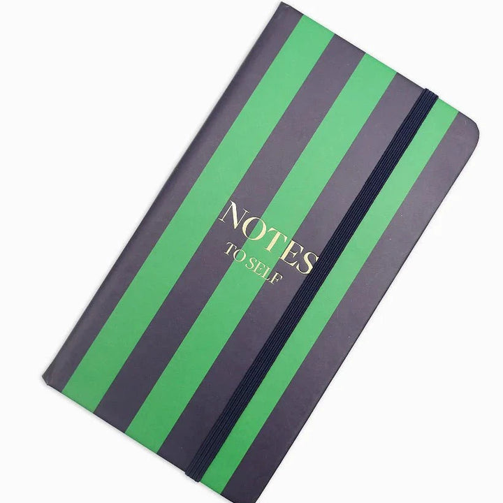 Notebook with green and gray striped cover on a white background