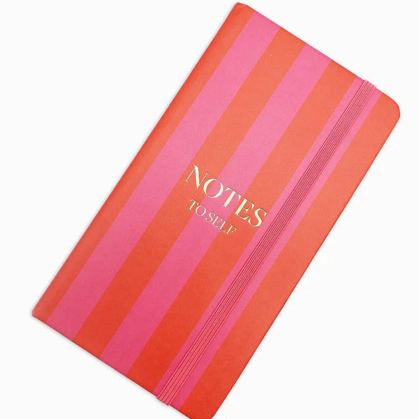 Notebook with pink and orange stripes and 'NOTES TO SELF' text on a white background