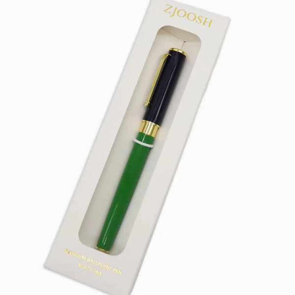 Green pen with gold accents in a white box packaging on a white background