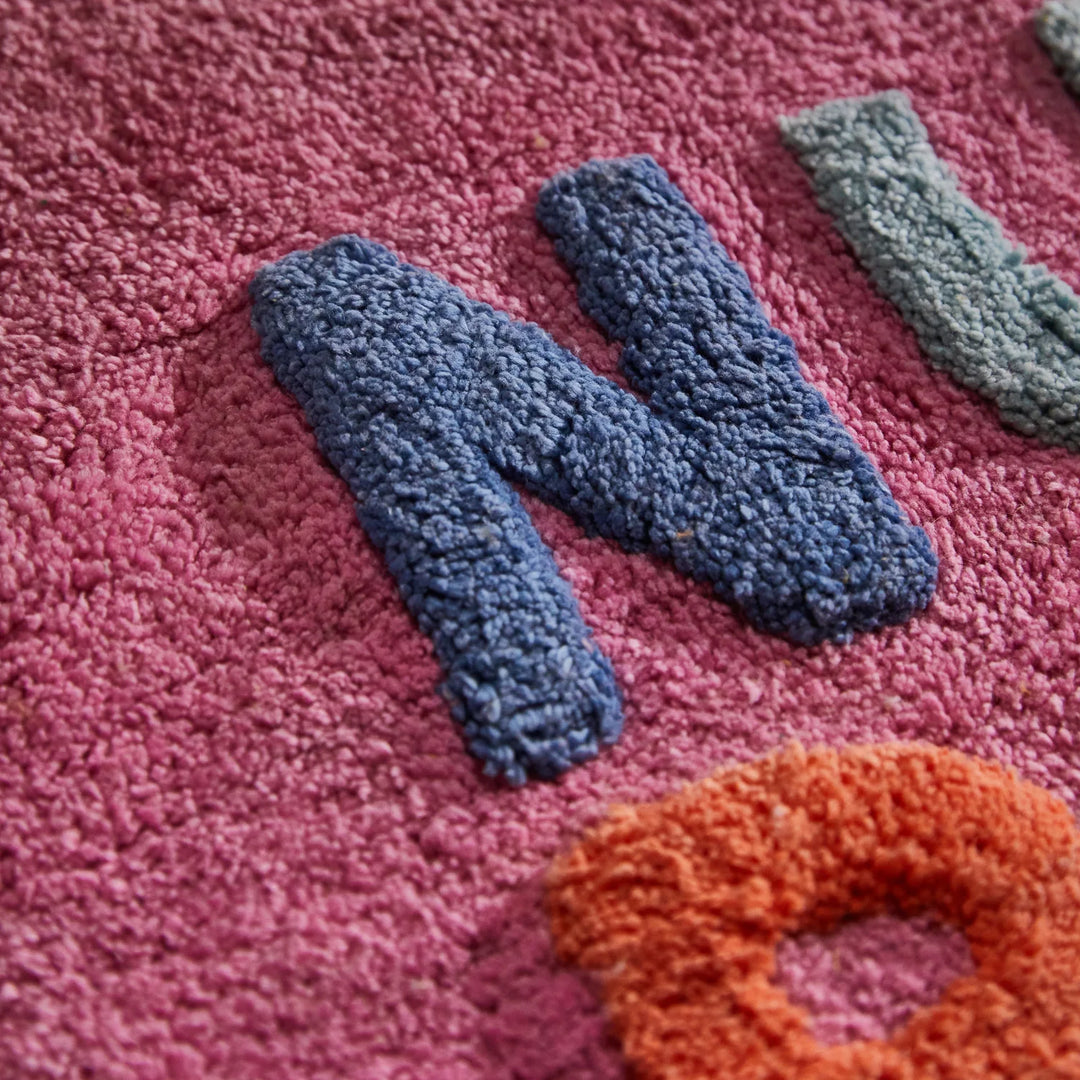 Textured letters 'N' and 'O' on a pink background