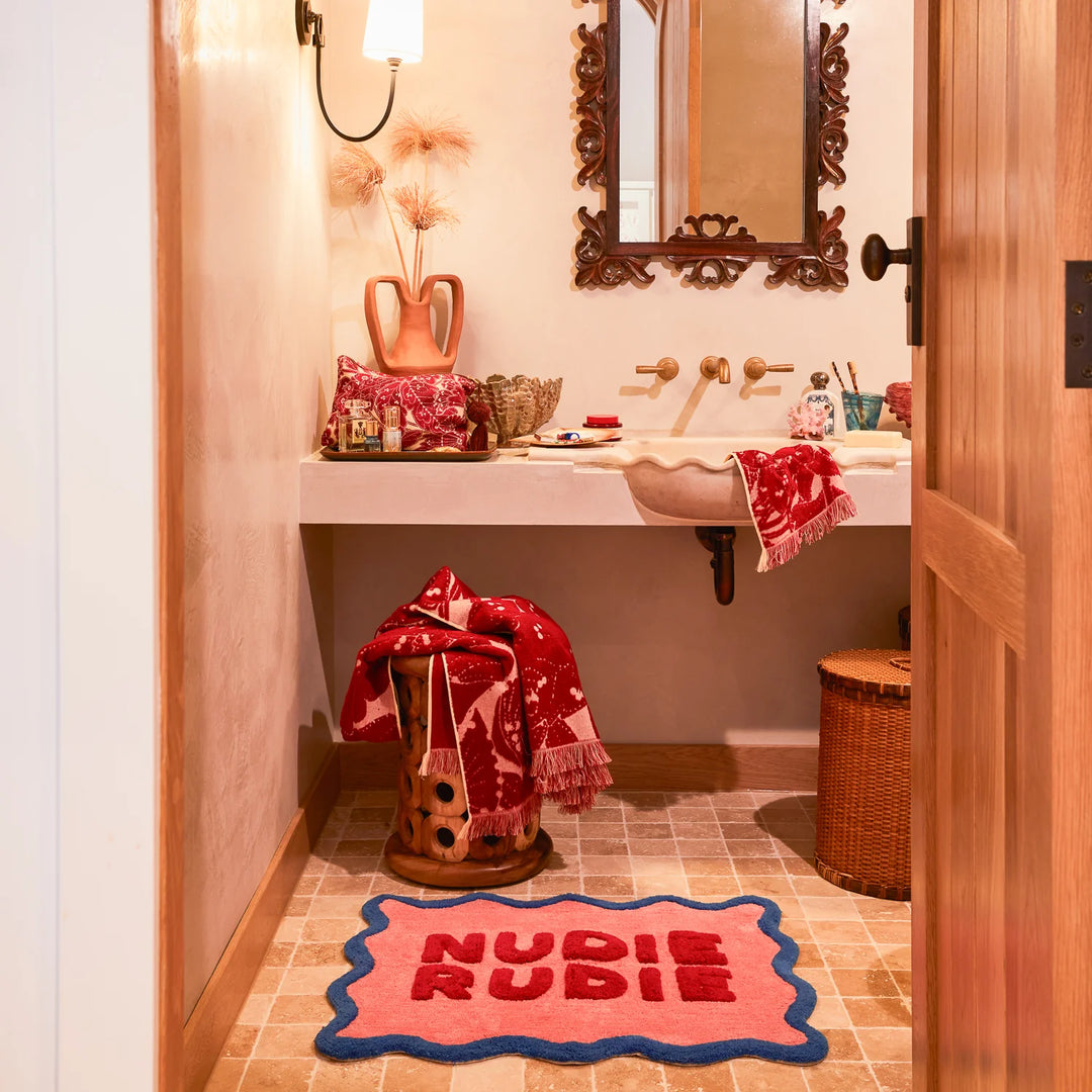 Bathroom interior with a sink, mirror, and decorative elements.