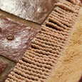Close-up of textured brown and gold surface with intricate patterns