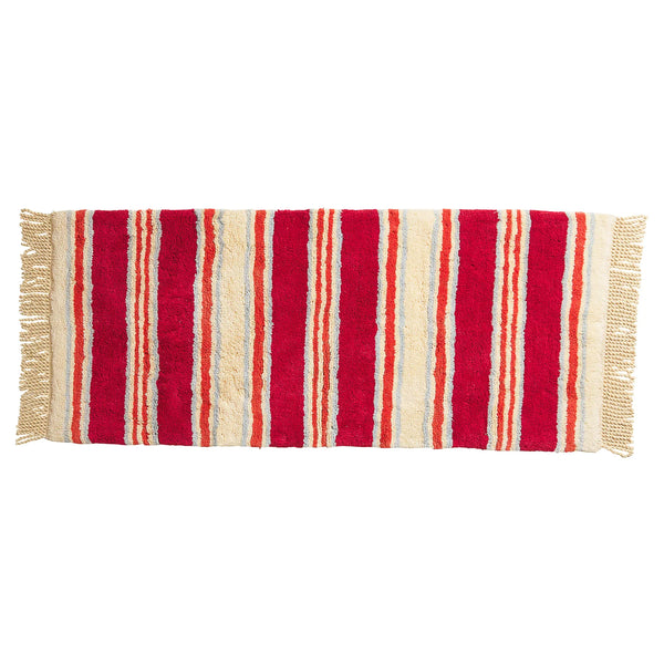 Striped red and beige rug with fringes on a white background